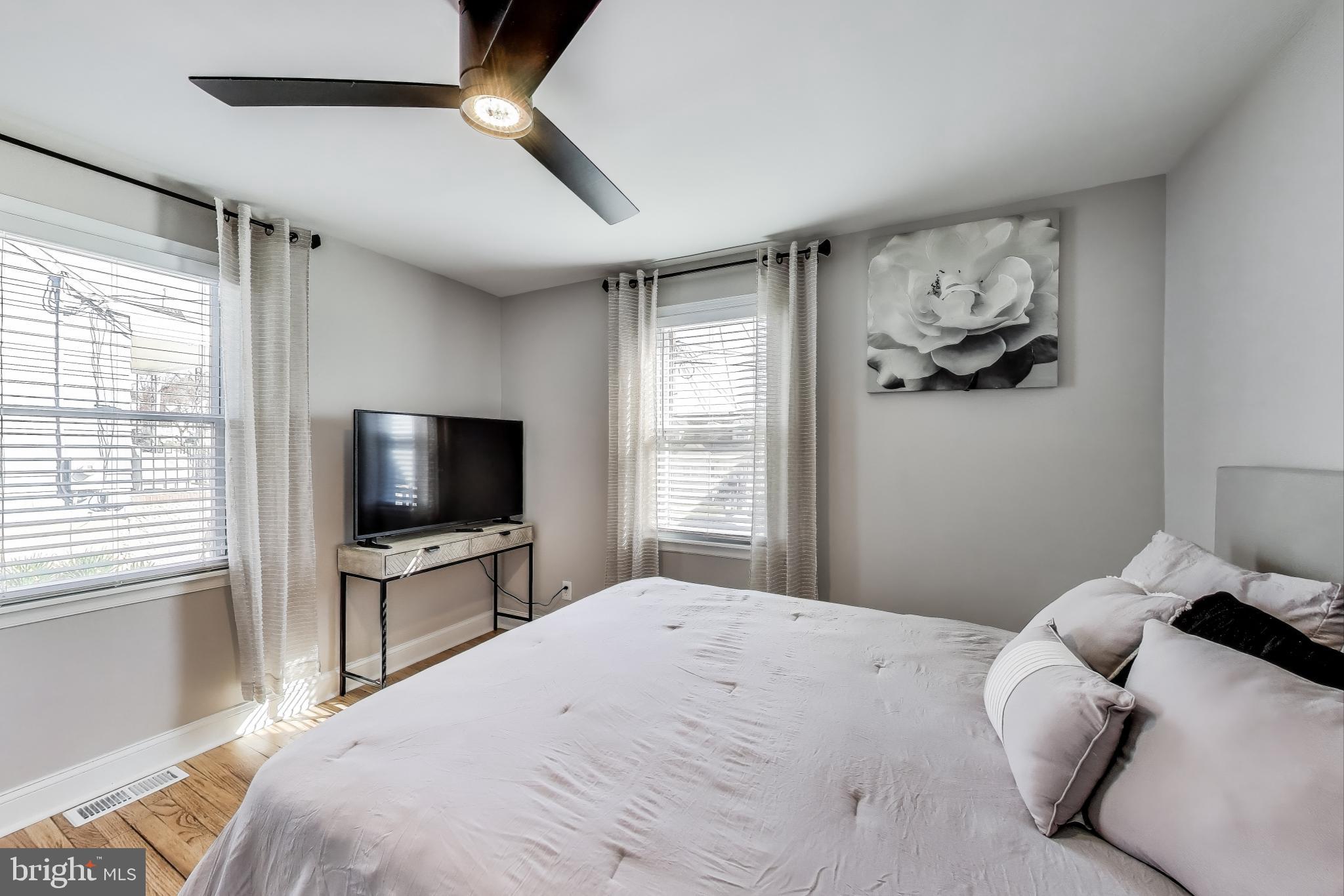 1225 Landover Road Rosedale, MD 21237 - Photo 12 of 48 a bedroom with a bed and a flat screen tv