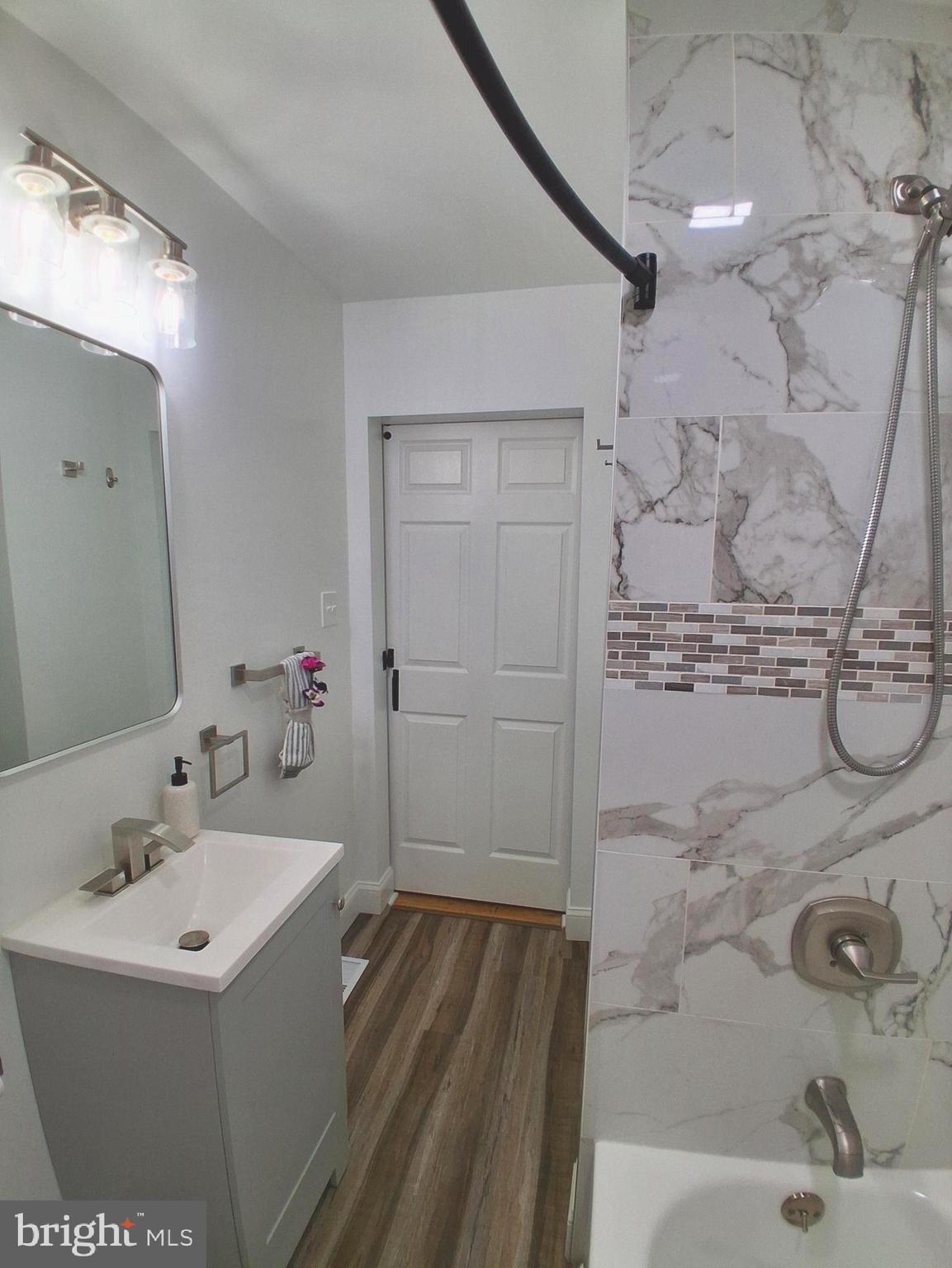 1225 Landover Road Rosedale, MD 21237 - Photo 14 of 48 a bathroom with a sink and mirror