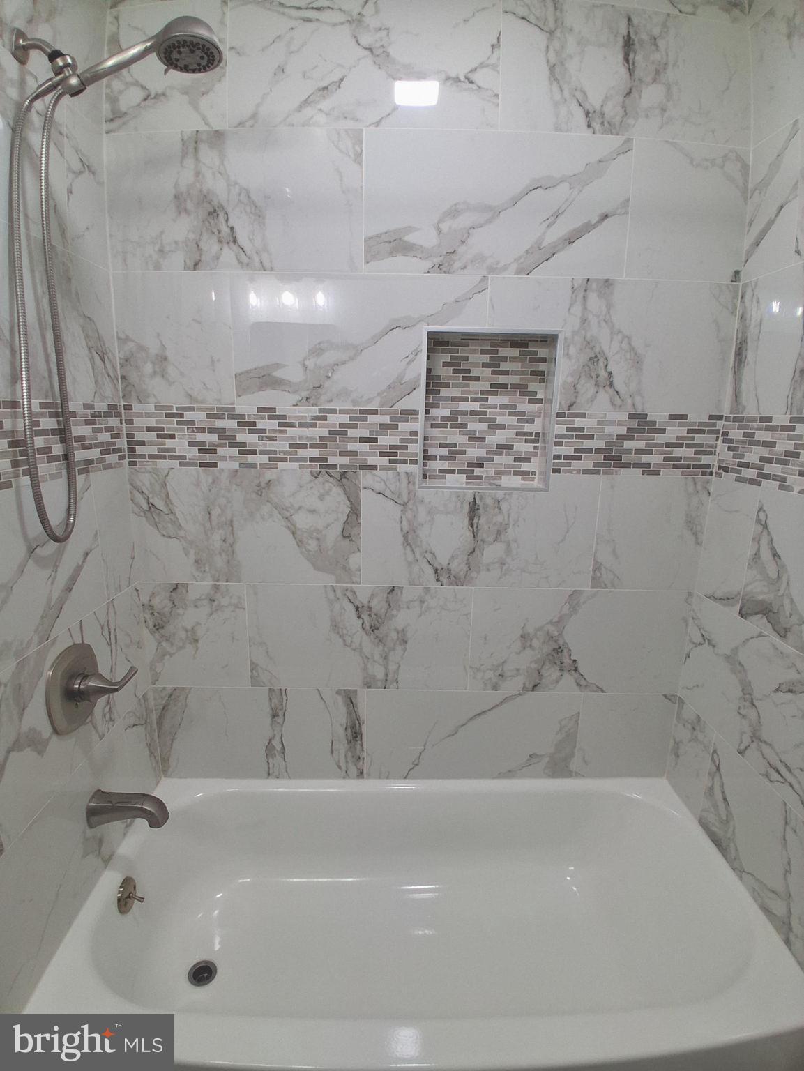 1225 Landover Road Rosedale, MD 21237 - Photo 15 of 48 a bathroom with a bathtub