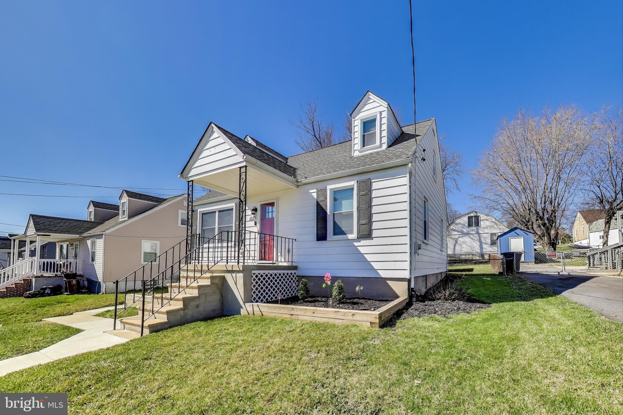 1225 Landover Road Rosedale, MD 21237 - Photo 47 of 48 a front view of a house with a yard