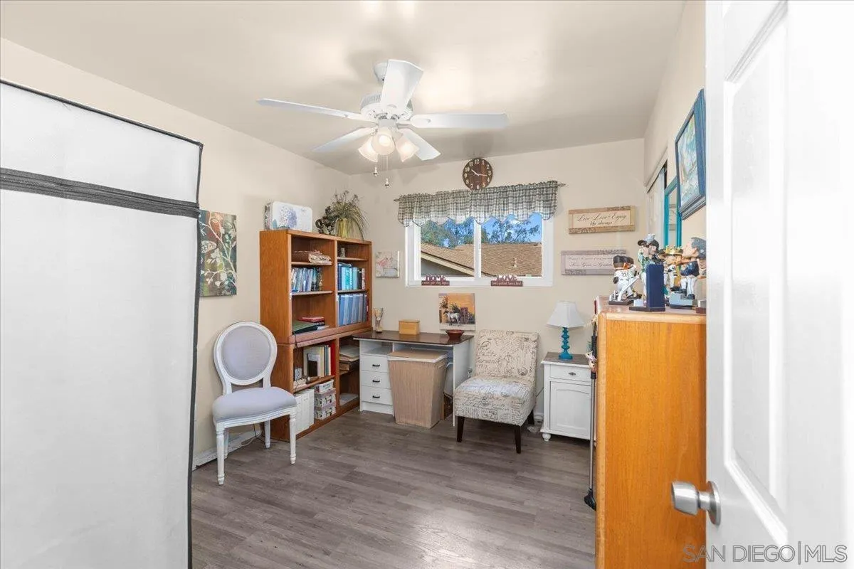 9254 Shadow Hill Road Santee, CA 92071 - Photo 18 of 34 a living room with furniture and a chandelier