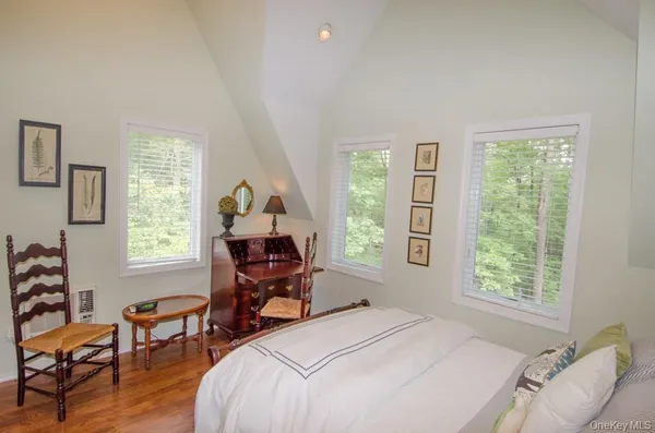 a bedroom with a bed and a windows