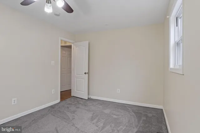 a bathroom with a sink toilet vanity and shower