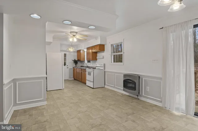 a view of a kitchen with a sink cabinets and a window