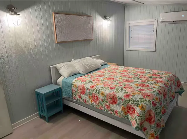 a bedroom with a bed and a window