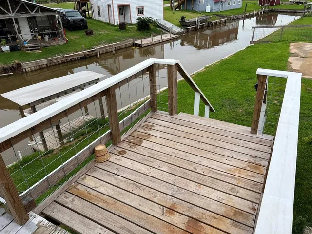 a view of a balcony with two chairs