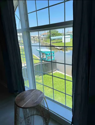 a view of a room with a large window