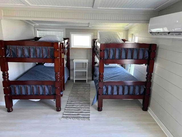 a view of bedroom with furniture and wooden floor
