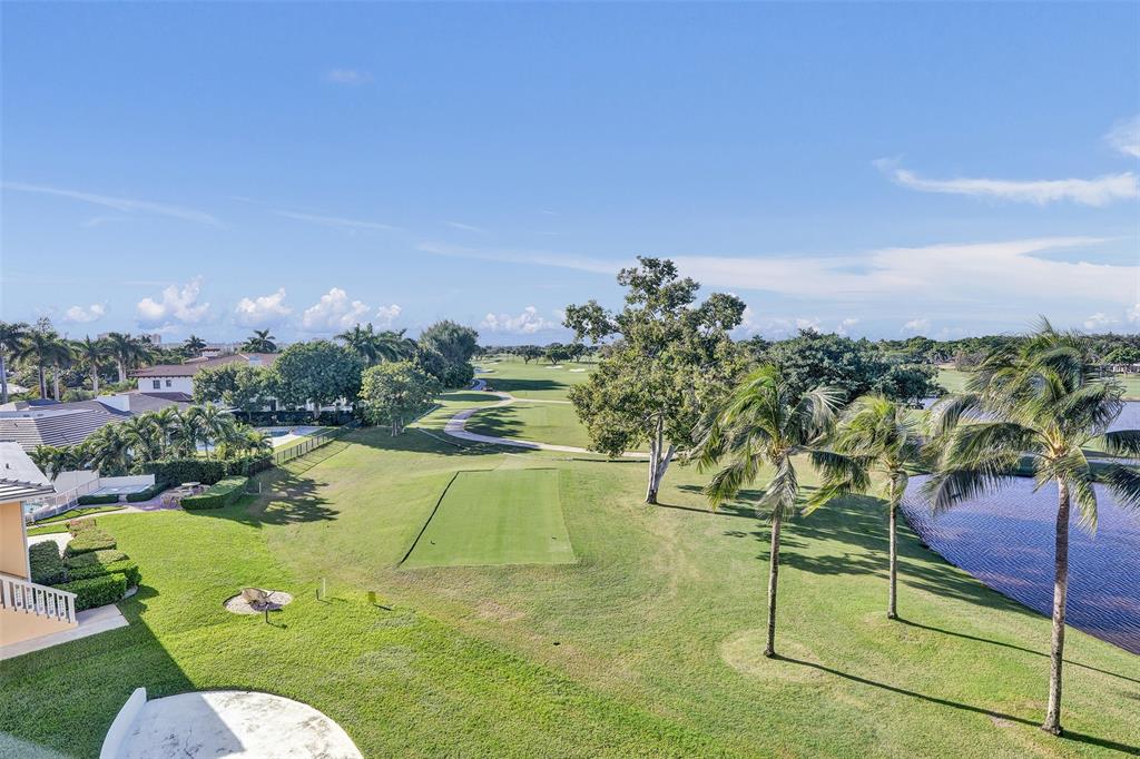 2500 Northeast 48th Lane, Unit 403 Fort Lauderdale, FL 33308 - Photo 1 of 24 a view of a swimming pool with a patio