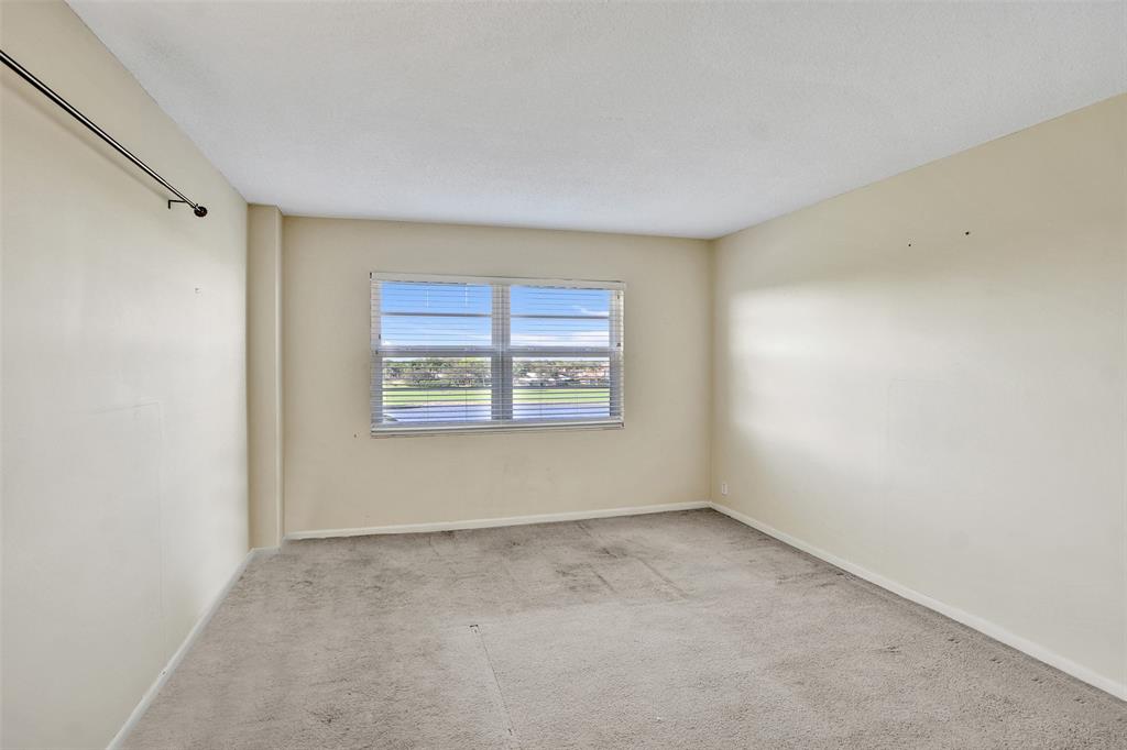 2500 Northeast 48th Lane, Unit 403 Fort Lauderdale, FL 33308 - Photo 12 of 24 a view of an empty room with a window