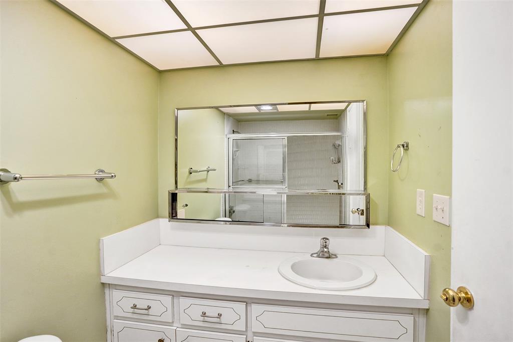 2500 Northeast 48th Lane, Unit 403 Fort Lauderdale, FL 33308 - Photo 13 of 24 a bathroom with a sink and a mirror