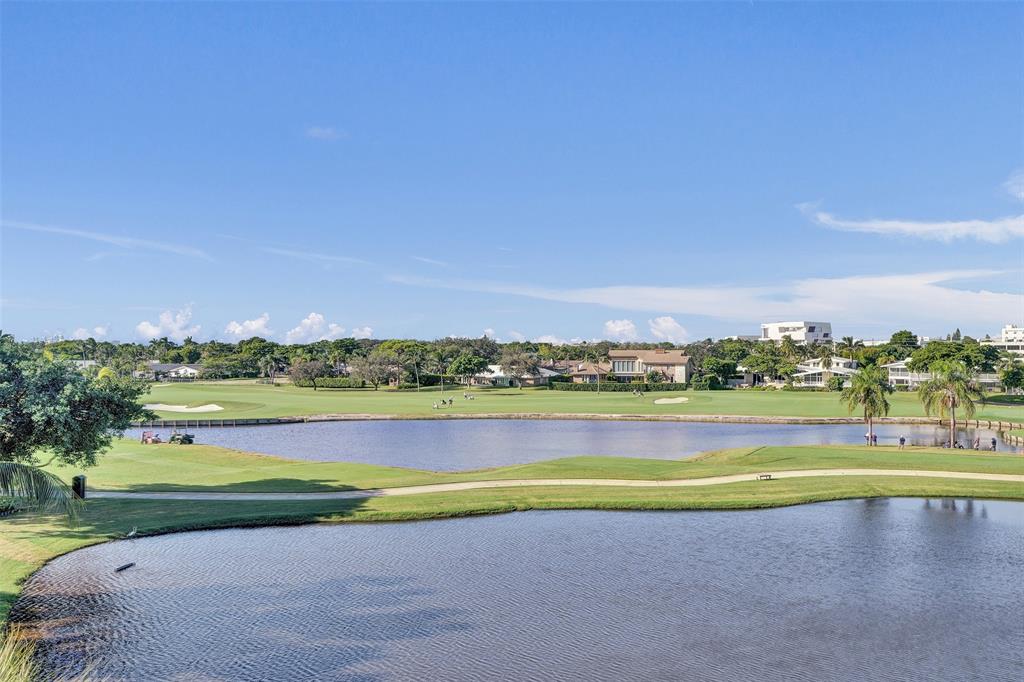2500 Northeast 48th Lane, Unit 403 Fort Lauderdale, FL 33308 - Photo 14 of 24 a view of a golf course with a lake view