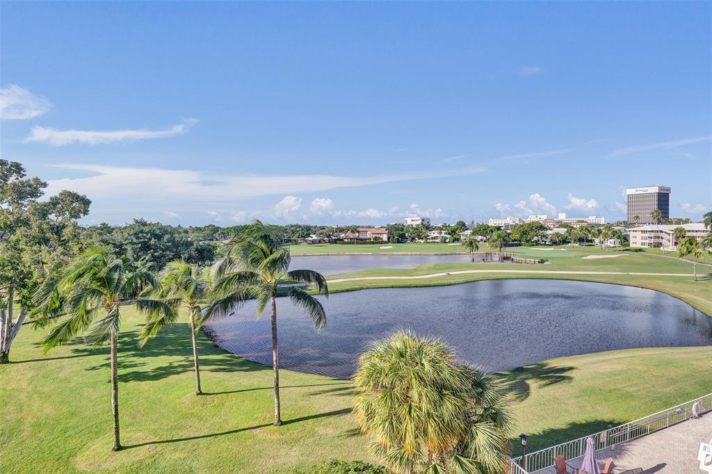 2500 Northeast 48th Lane, Unit 403 Fort Lauderdale, FL 33308 - Photo 15 of 24 a view of a swimming pool with a yard
