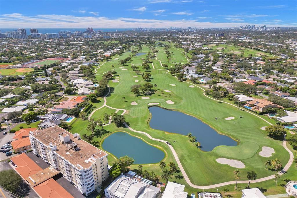2500 Northeast 48th Lane, Unit 403 Fort Lauderdale, FL 33308 - Photo 19 of 24 an aerial view of a residential houses with outdoor space and trees