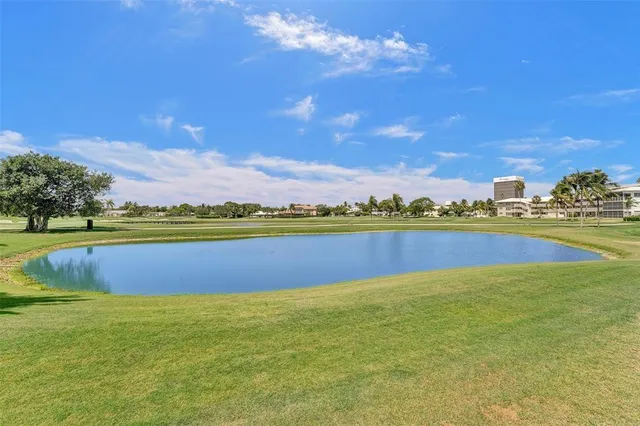 a view of a swimming pool with lounge chairs