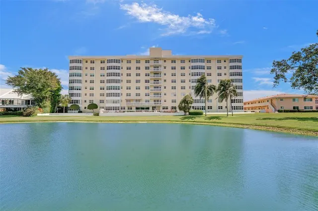 a view of a swimming pool and an outdoor seating