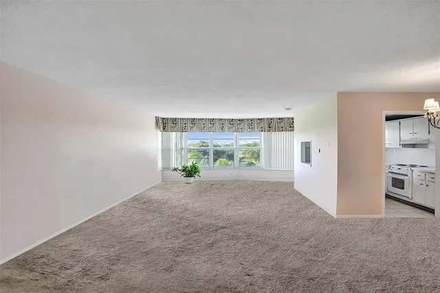 a view of a chandelier in big room and chandelier