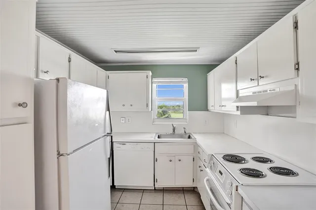 a bathroom with a sink and a window