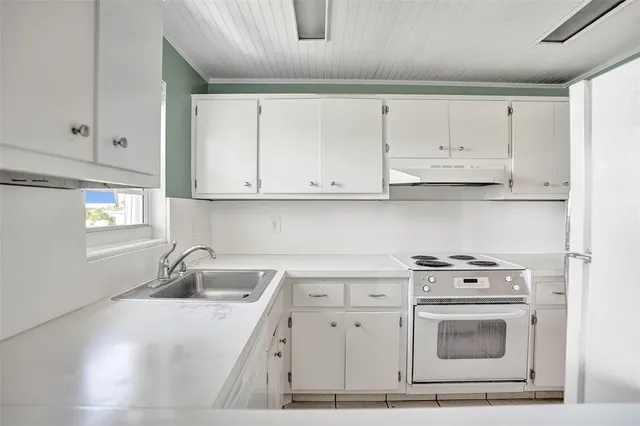 an empty room with windows and entrance