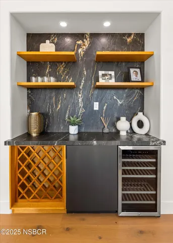 a kitchen with a wooden floor and a table