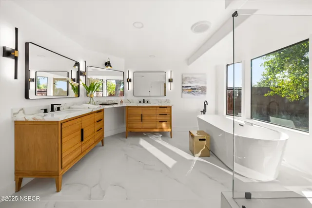 a kitchen that has a sink and chair