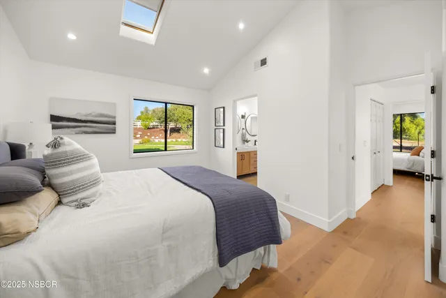 a bedroom with a bed and a couch