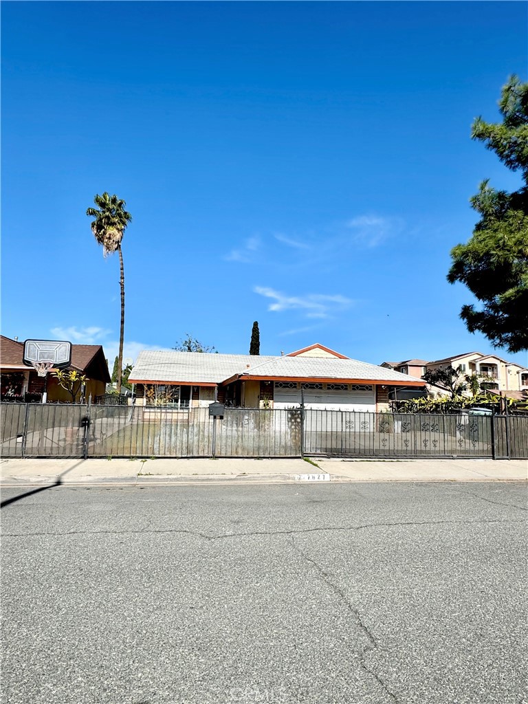 7627 Key W Drive Riverside, CA 92503 - Photo 2 of 7 a front view of a house with a garden