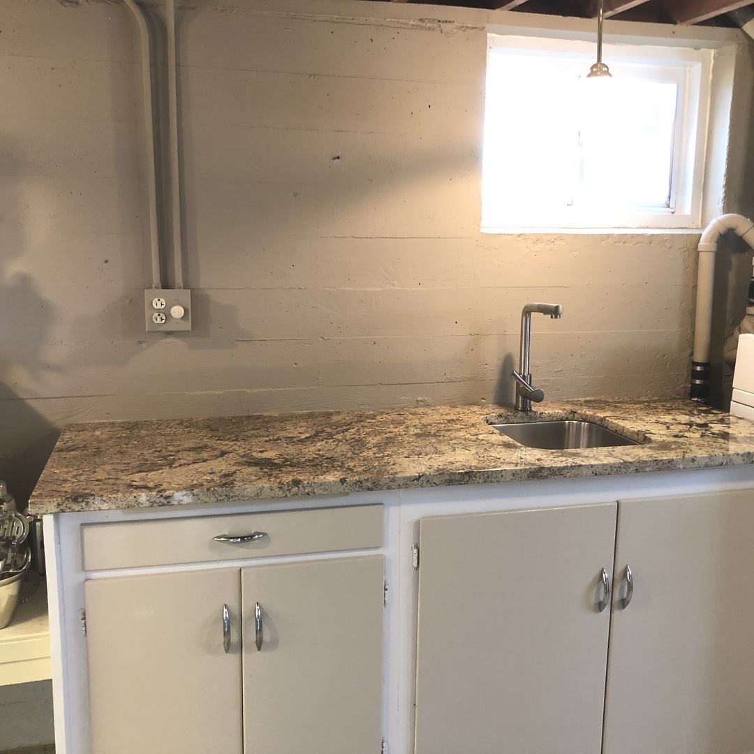 3137 River Road Kankakee, IL 60901 - Photo 28 of 44 a bathroom with a granite countertop sink and a mirror