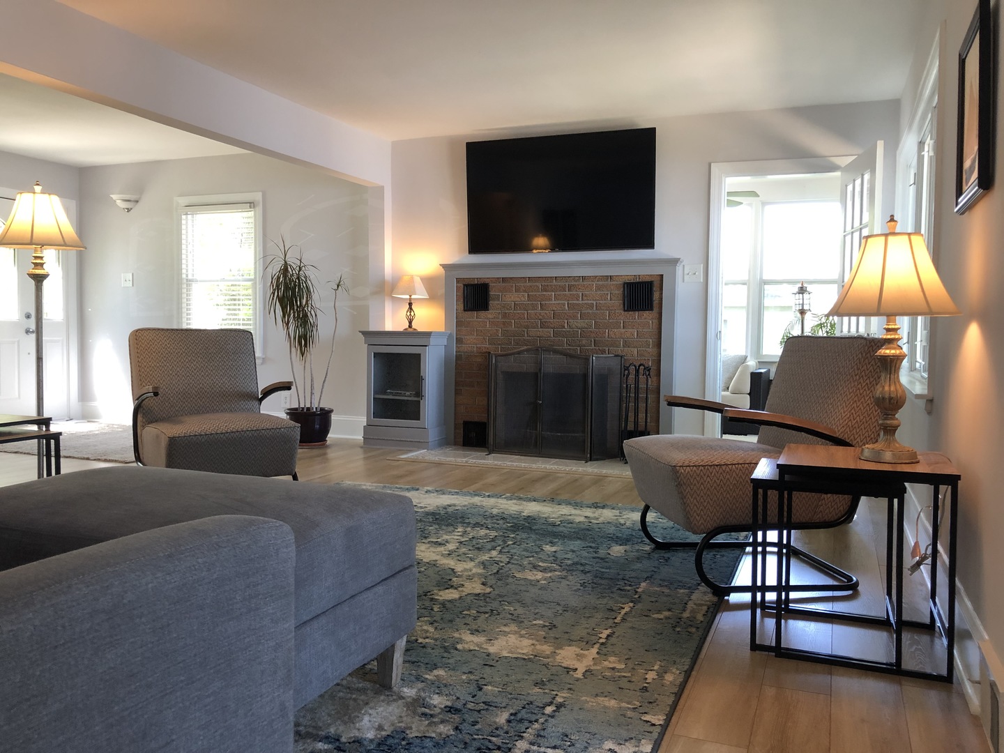 3137 River Road Kankakee, IL 60901 - Photo 4 of 44 a living room with furniture a fireplace and a flat screen tv