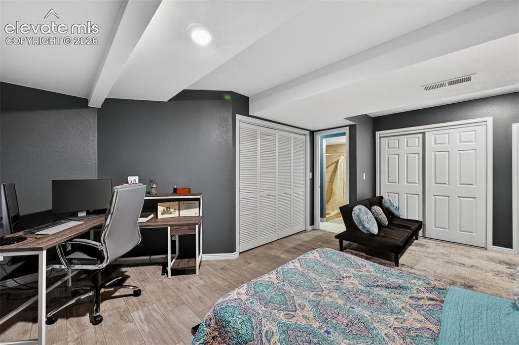 2141 Legacy Ridge View, Unit 109 Colorado Springs, CO 80910 - Photo 18 of 23 a bedroom with a workspace