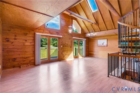 a view of a porch with wooden floor and roof