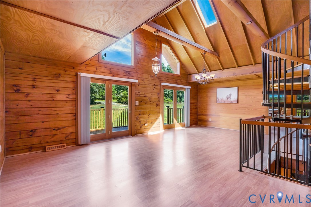a view of a porch with wooden floor and roof