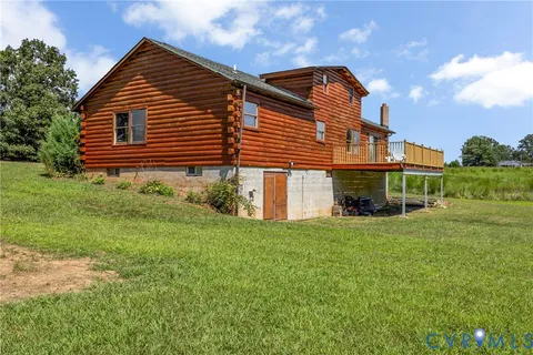 a view of a lake with houses in the back