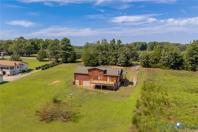 an aerial view of a houses with outdoor space and garden