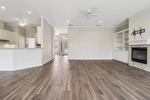 a view of kitchen with cabinets and wooden floor