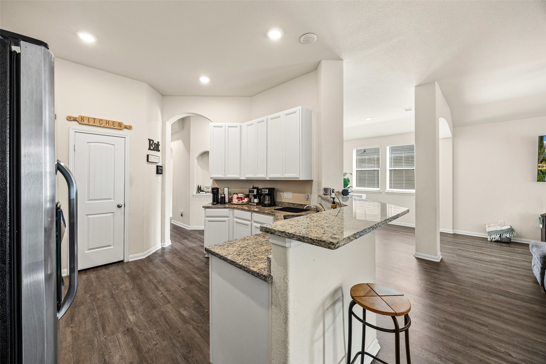 156 County Road Cleveland, TX 77327 - Photo 17 of 25 a kitchen with stainless steel appliances granite countertop a refrigerator and a stove top oven