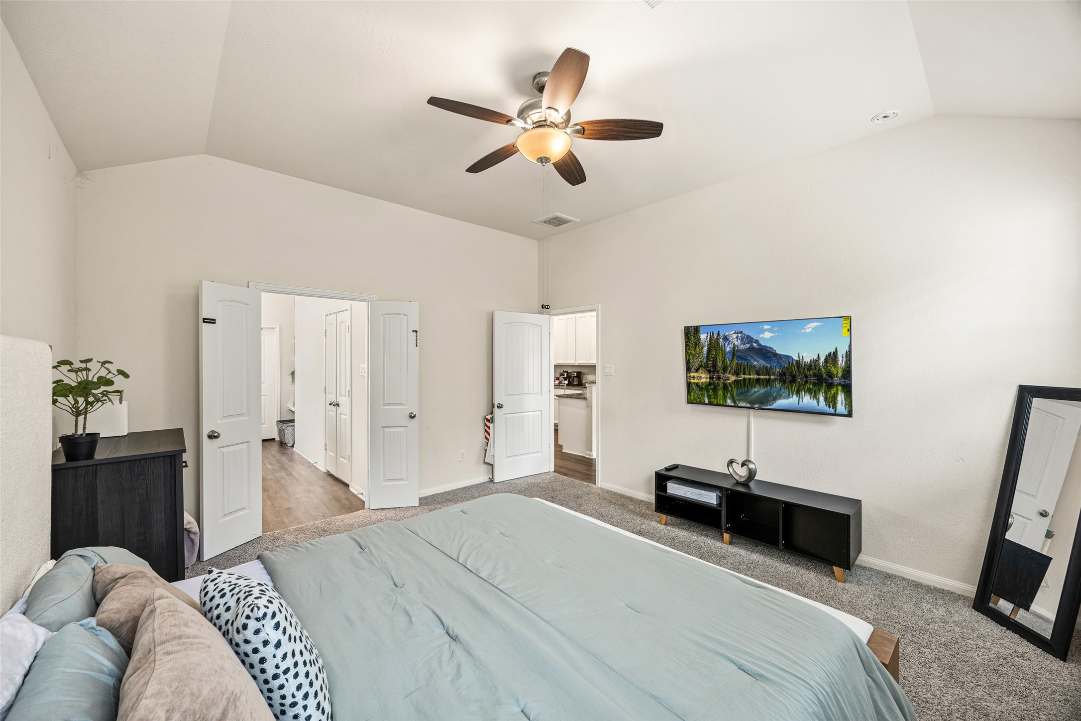 156 County Road Cleveland, TX 77327 - Photo 19 of 25 a bedroom with a bed and a flat screen tv