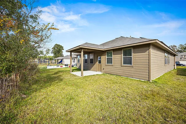 a backyard of a house with lots of green space