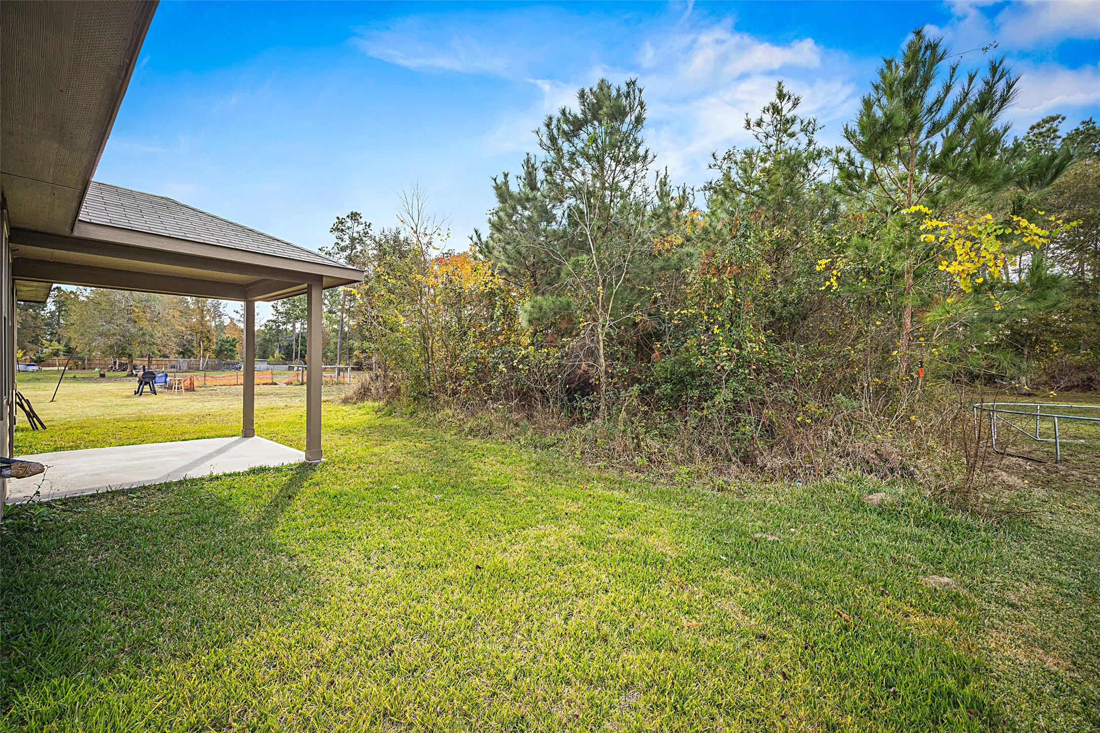 156 County Road Cleveland, TX 77327 - Photo 25 of 25 a view of an outdoor space and swimming pool