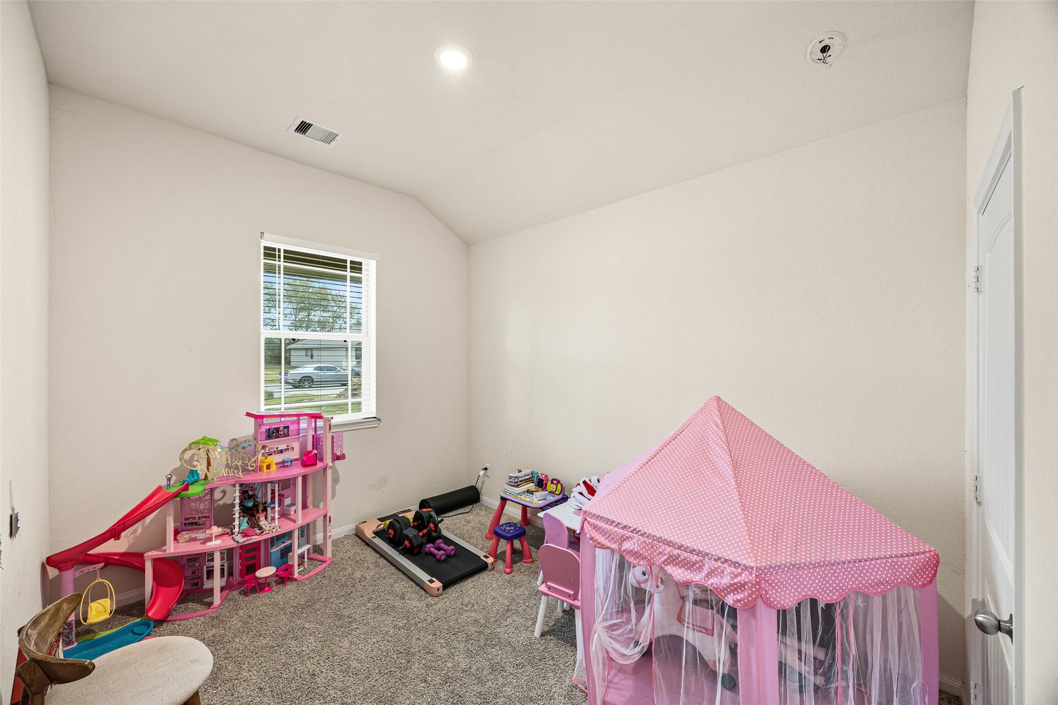 156 County Road Cleveland, TX 77327 - Photo 7 of 25 a bedroom with furniture and a window