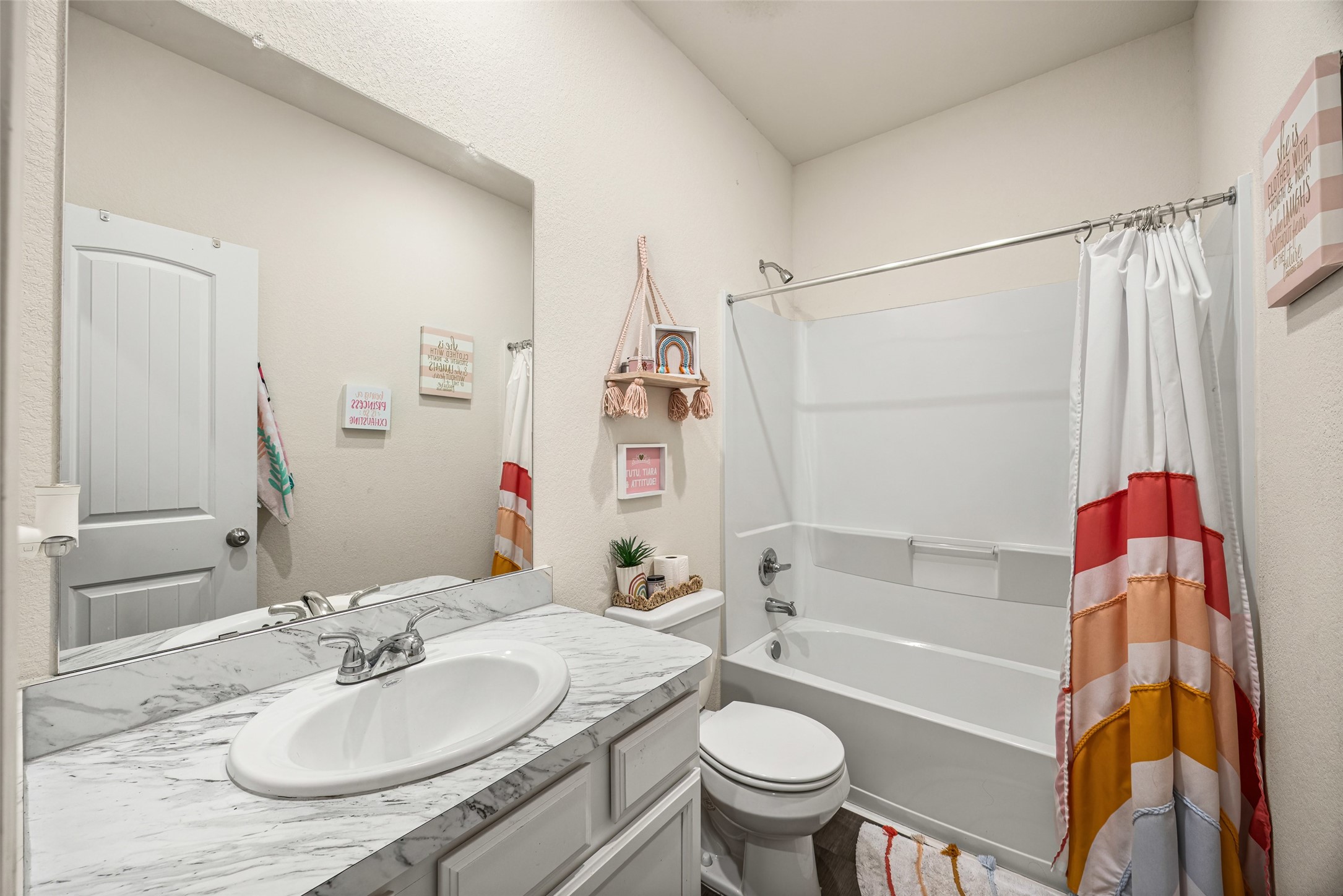156 County Road Cleveland, TX 77327 - Photo 8 of 25 a bathroom with a sink toilet and shower