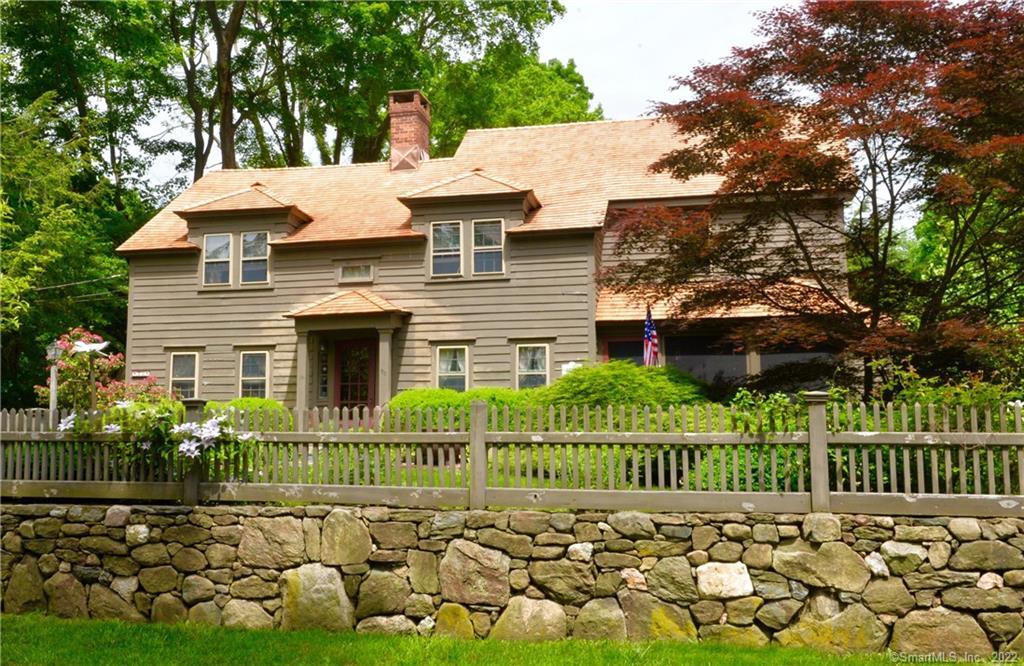 90 Olmstead Lane Ridgefield, CT 06877 - Photo 1 of 1 a view of a house with wooden fence