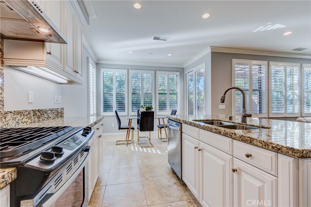 24 Oakfield Irvine, CA 92620 - Photo 12 of 30 a kitchen with sink stove and cabinets