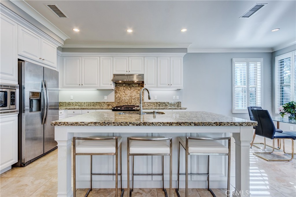 24 Oakfield Irvine, CA 92620 - Photo 13 of 30 a kitchen with granite countertop cabinets and refrigerator