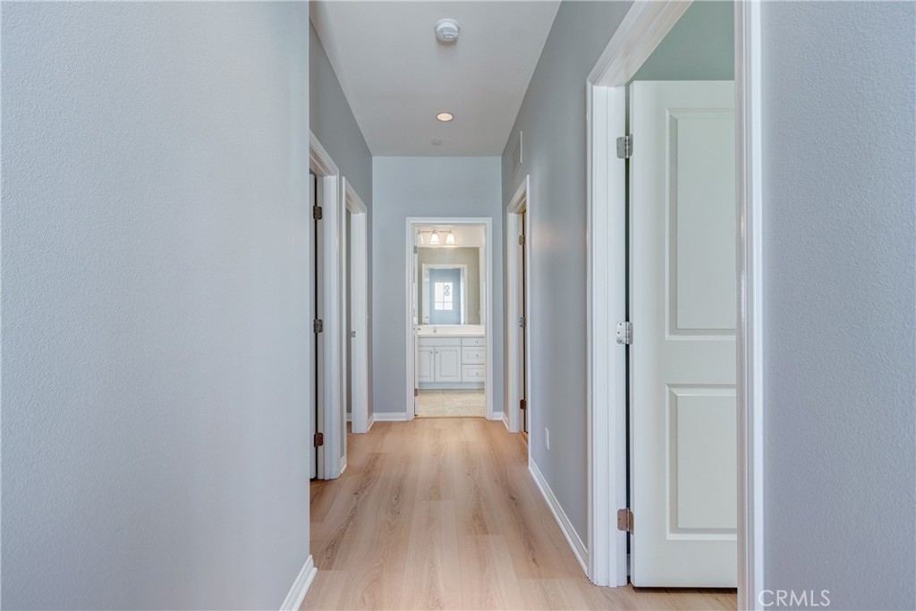 24 Oakfield Irvine, CA 92620 - Photo 15 of 30 a view of a hallway with wooden floor