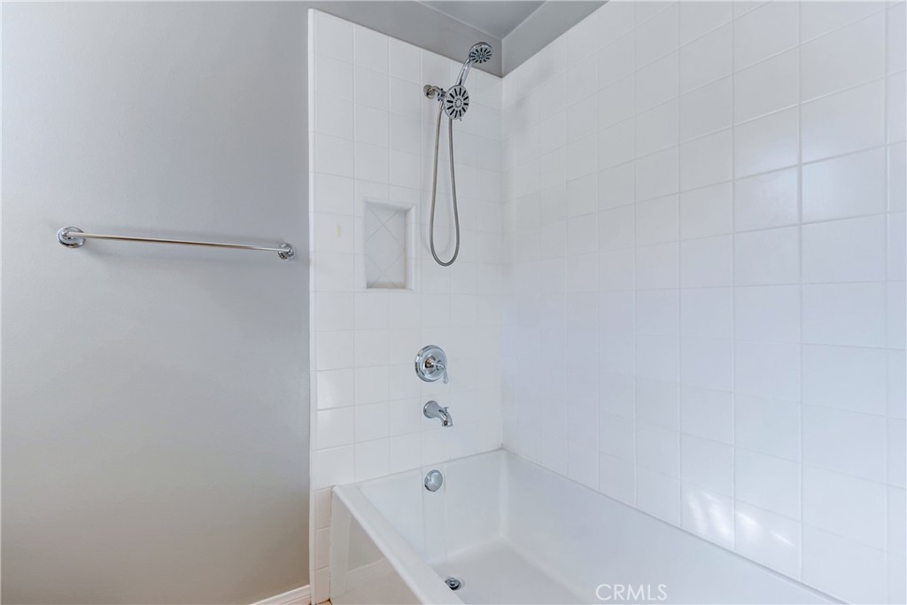 24 Oakfield Irvine, CA 92620 - Photo 25 of 30 a bathroom with a bath tub with a shower