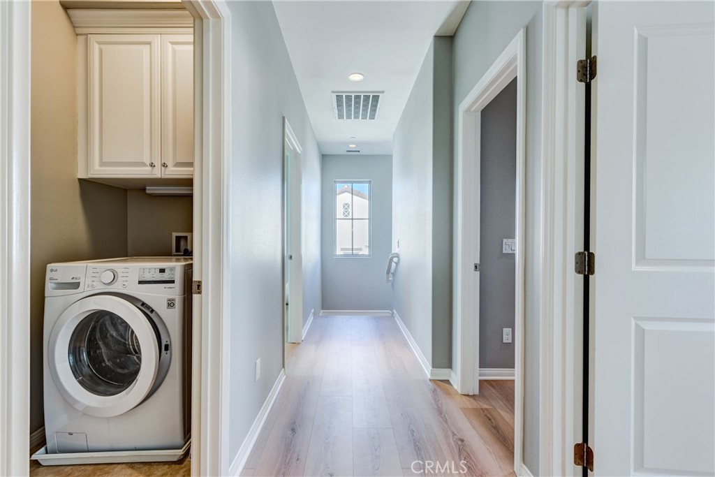 24 Oakfield Irvine, CA 92620 - Photo 26 of 30 a view of a hallway with washer and dryer