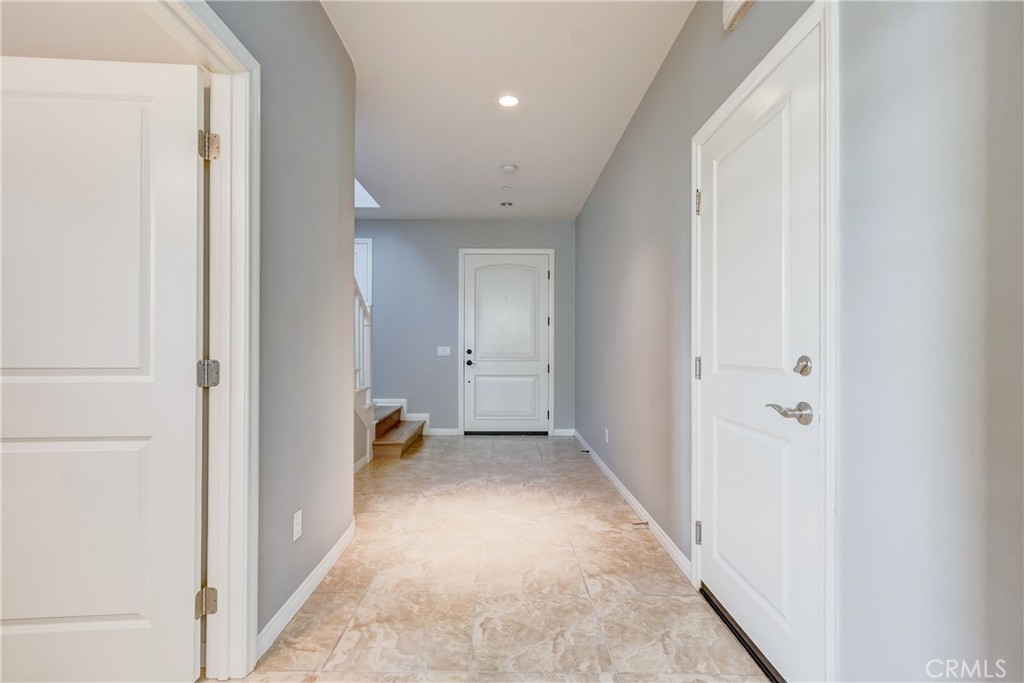 24 Oakfield Irvine, CA 92620 - Photo 4 of 30 a view of a hallway with closet and a bathroom