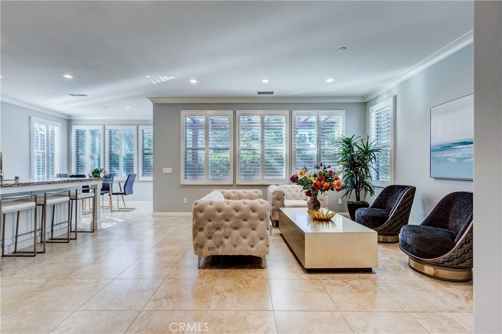 24 Oakfield Irvine, CA 92620 - Photo 6 of 30 a living room with furniture and a large window