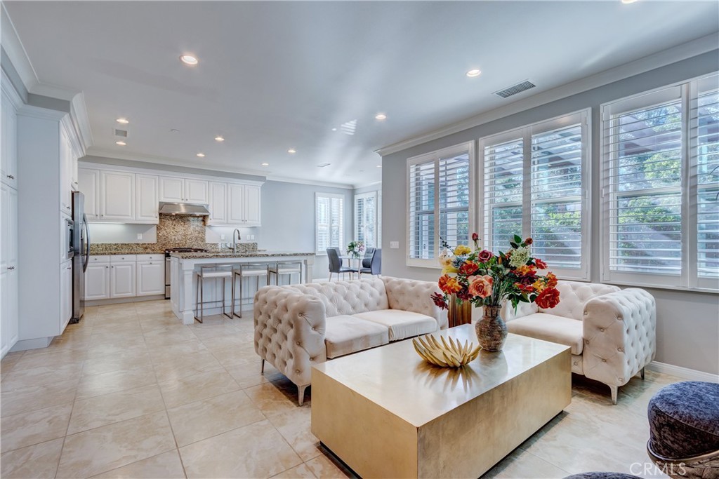 24 Oakfield Irvine, CA 92620 - Photo 7 of 30 a living room with furniture and a large window